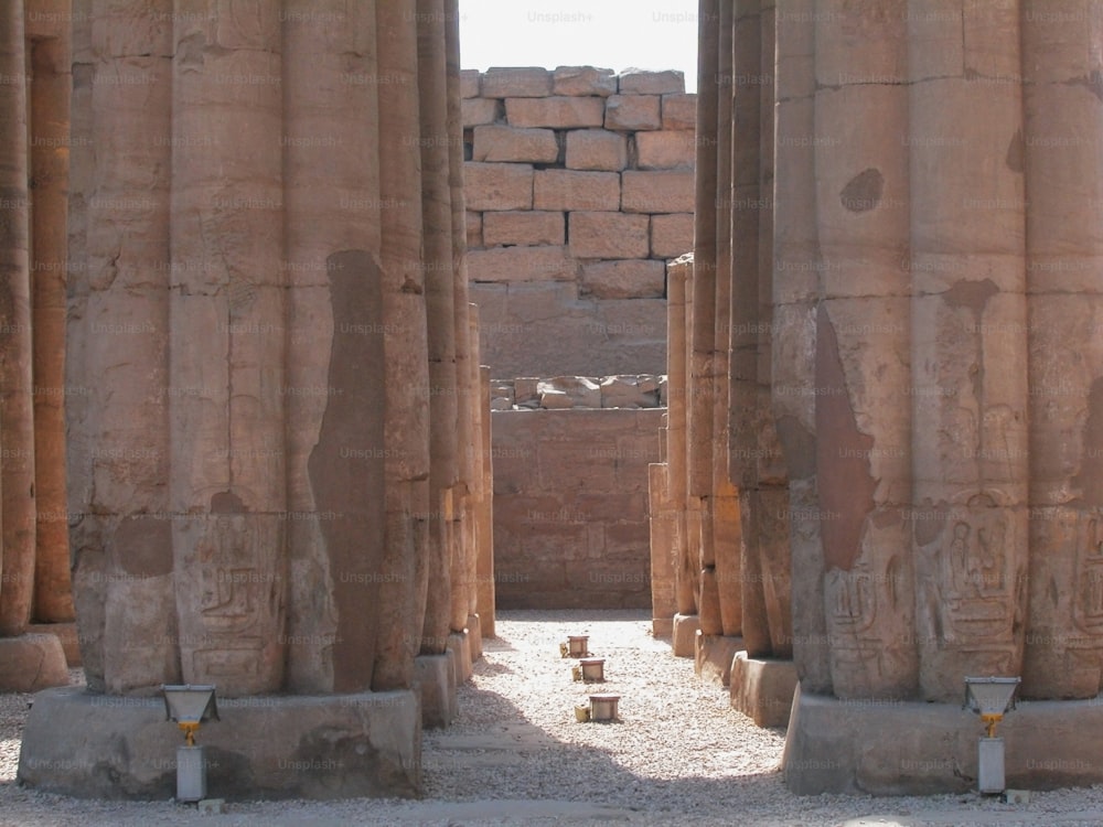 a group of stone pillars in a building