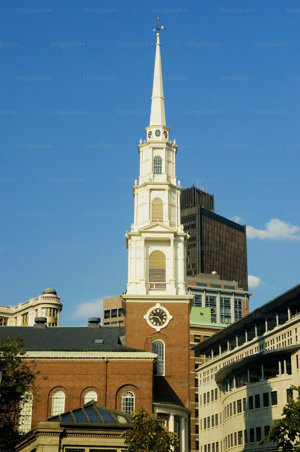 a church steeple with a clock on it