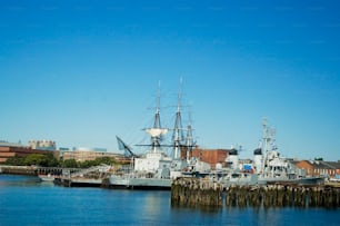 a large boat docked in a harbor next to a city