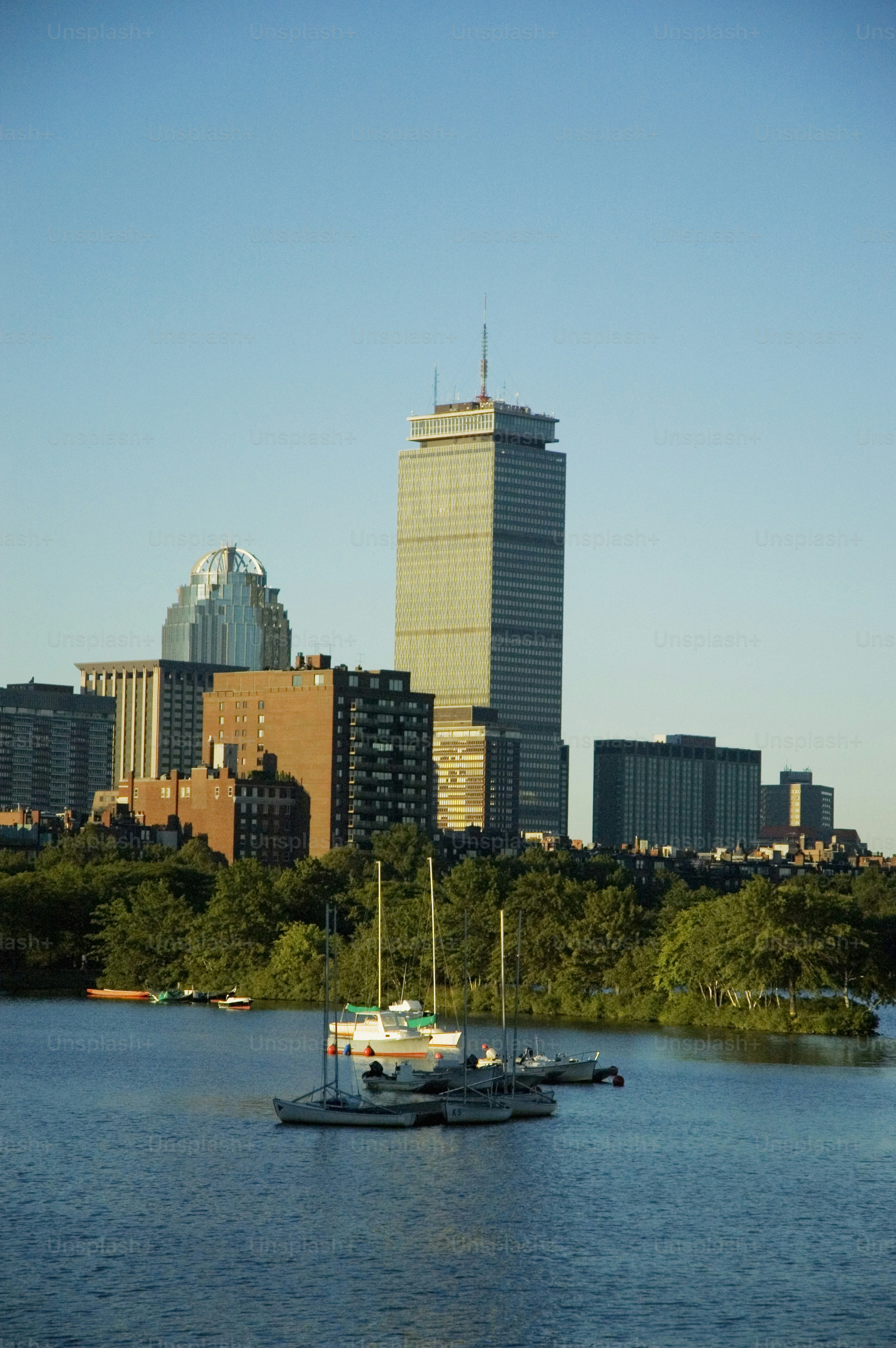 a body of water with a boat in it and a city in the background