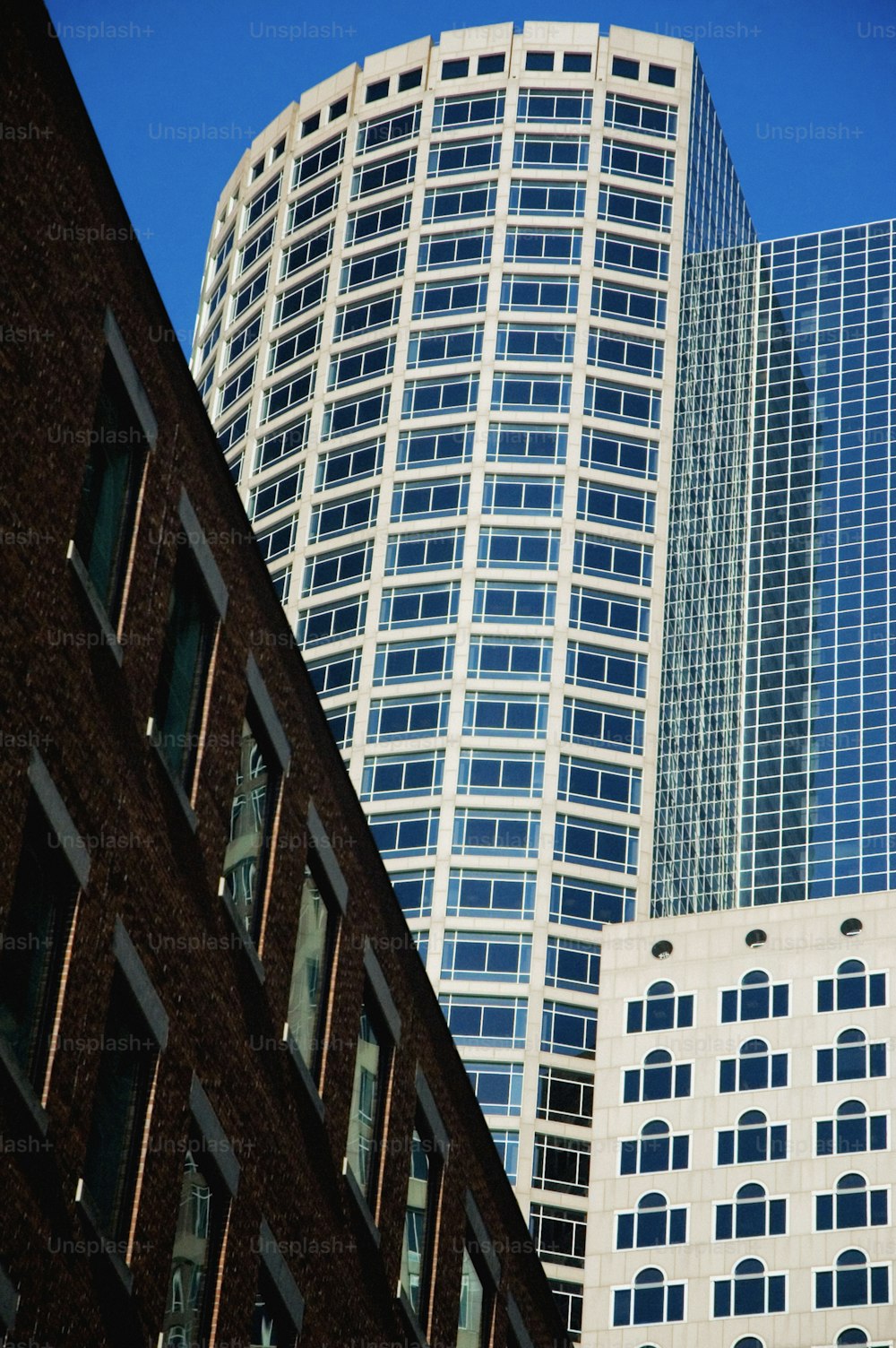 a tall building next to a very tall building