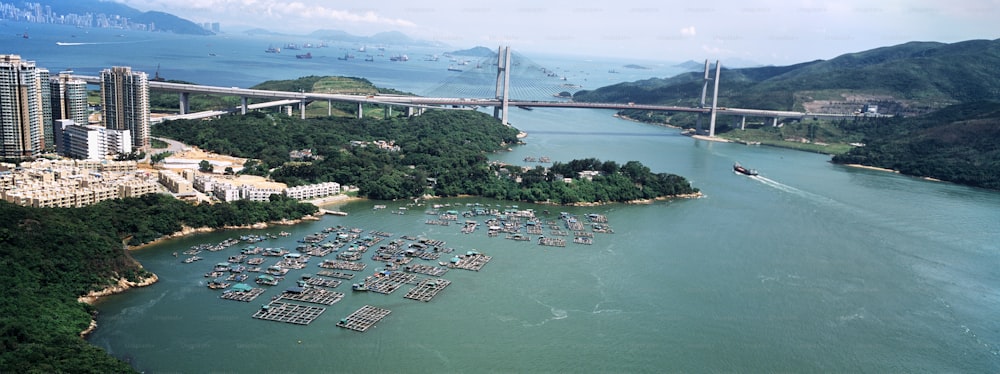 an aerial view of a harbor and a bridge