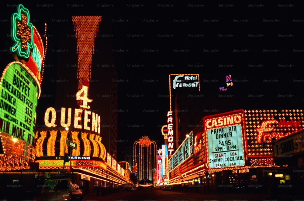 a city street filled with lots of neon signs