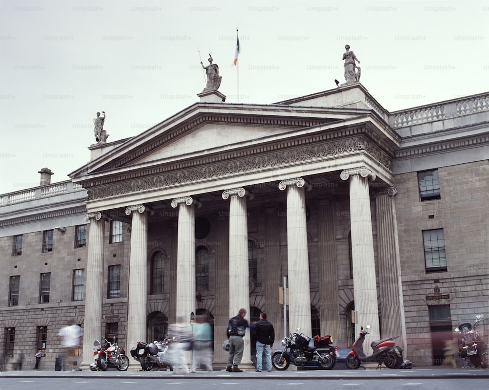 a group of people standing in front of a building