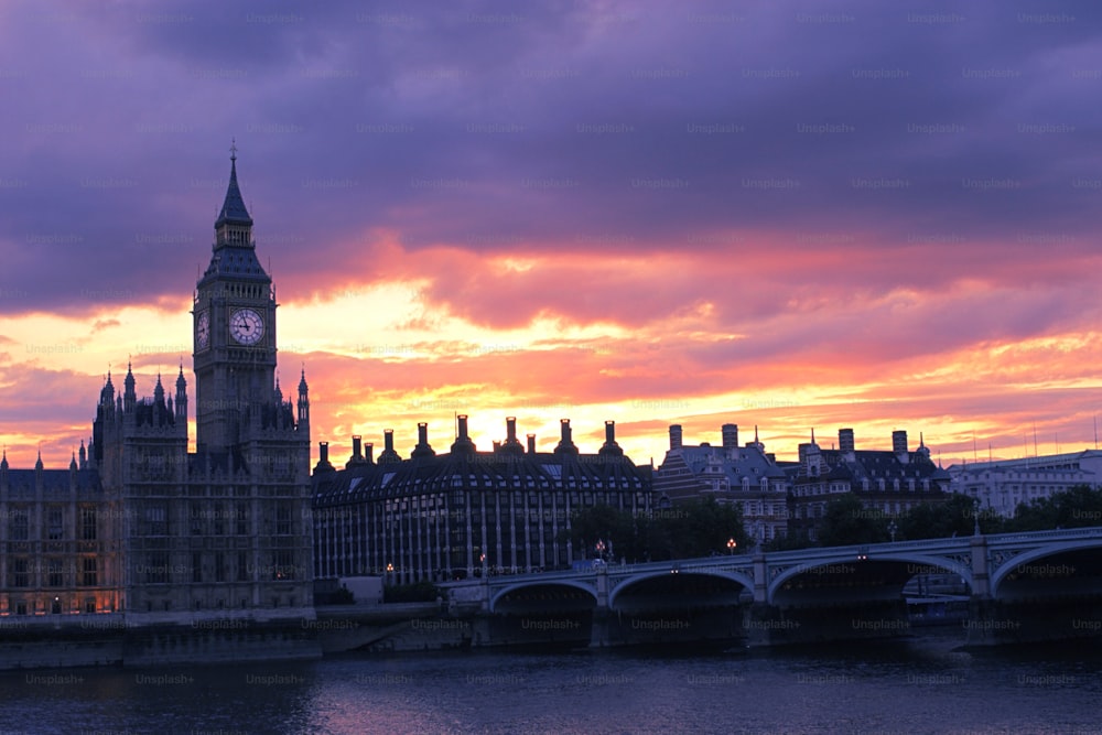 a view of the big ben clock tower from across the river