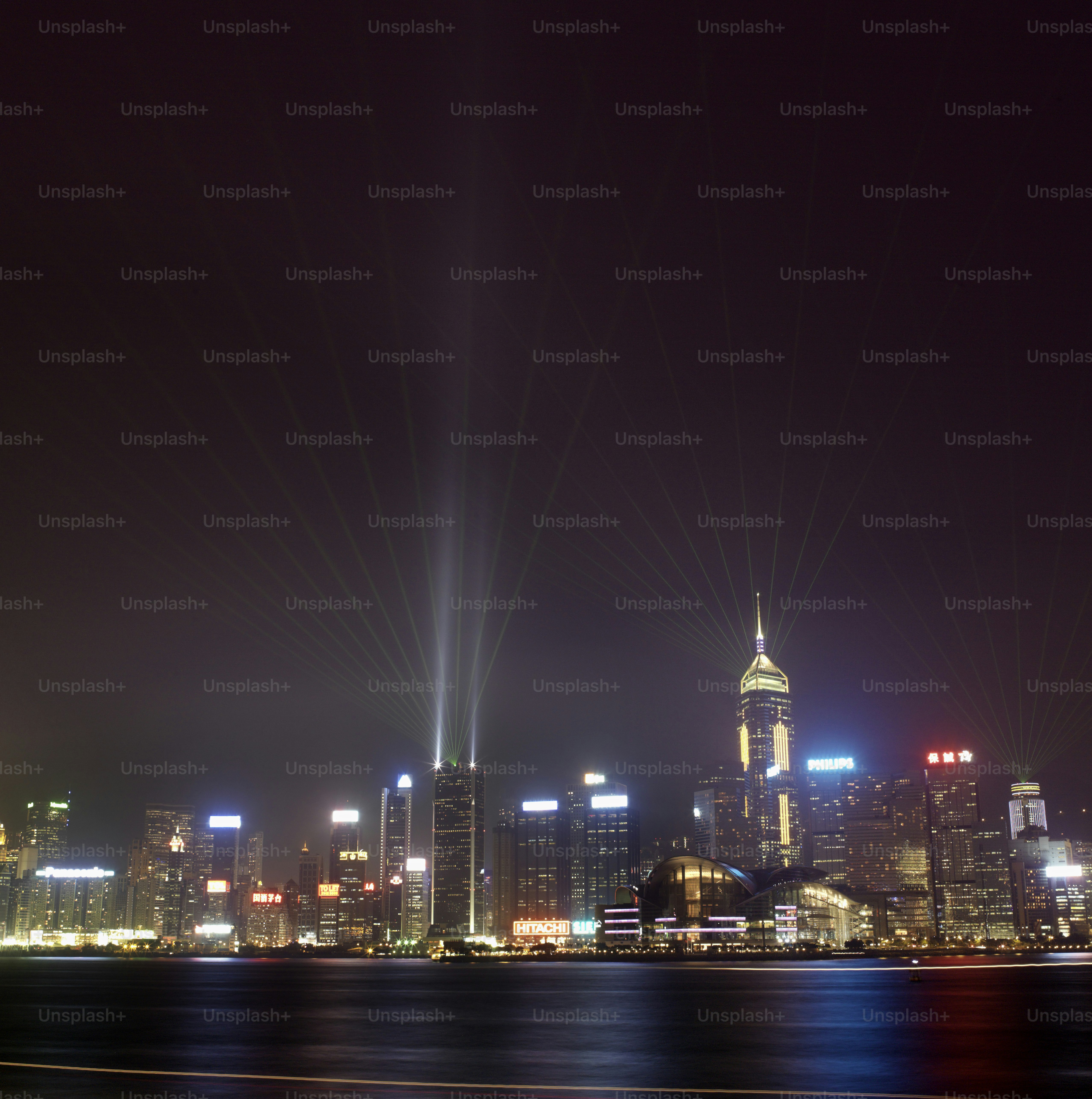 a view of a city at night from the water