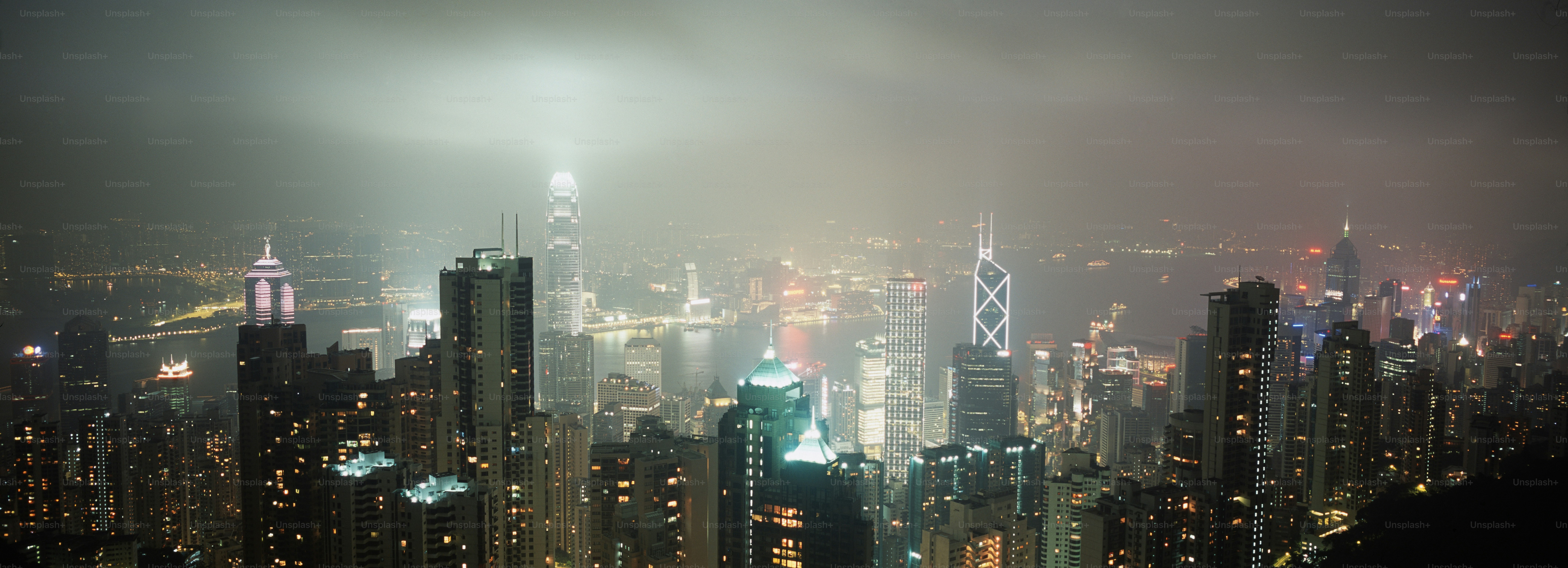 A view of a city at night from the top of a skyscraper photo – Night ...