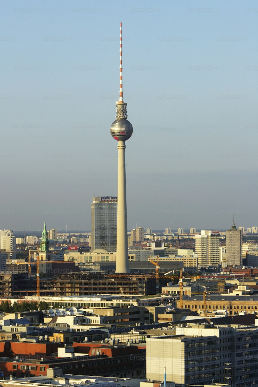 a view of a city with a very tall tower