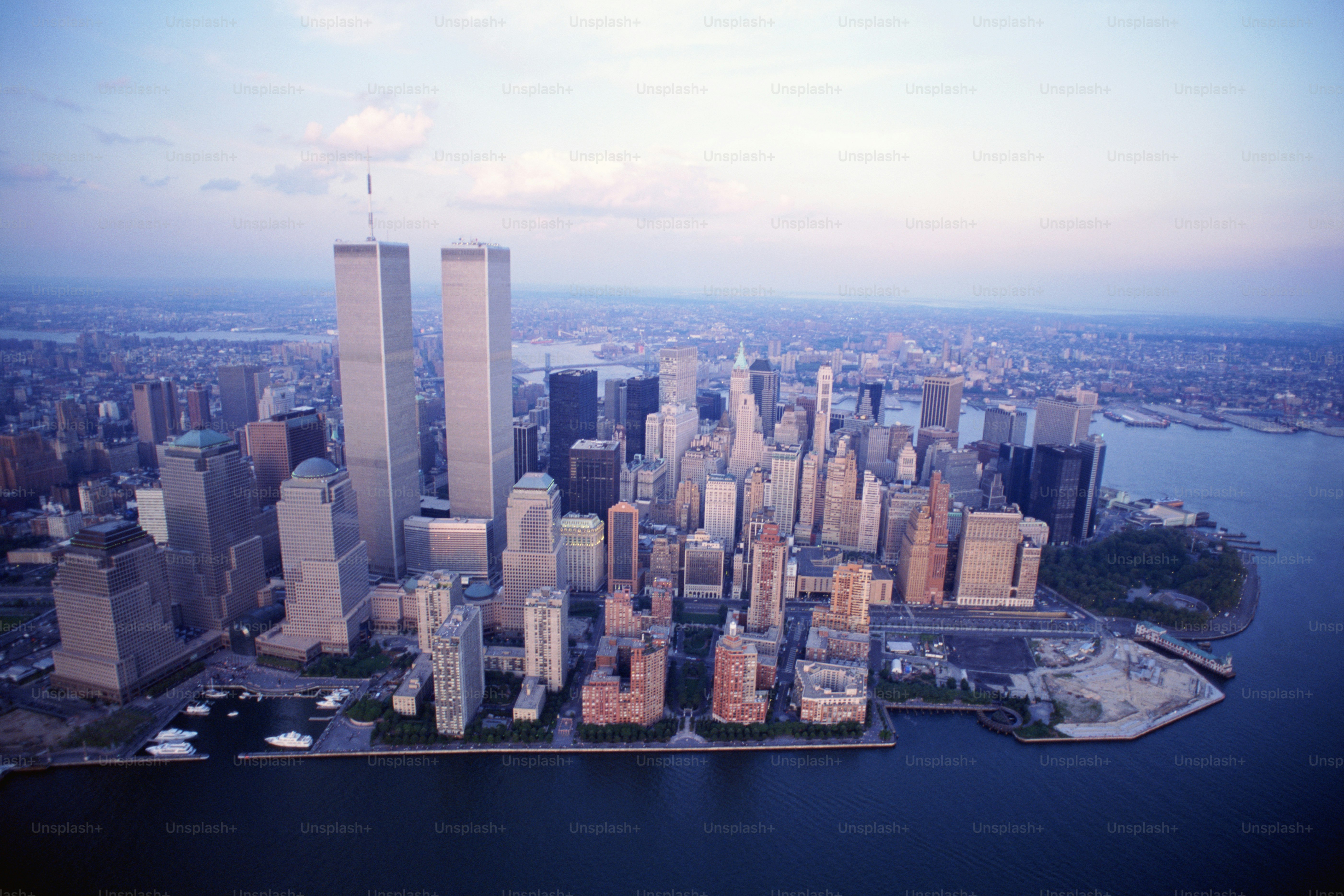 an aerial view of a city with tall buildings