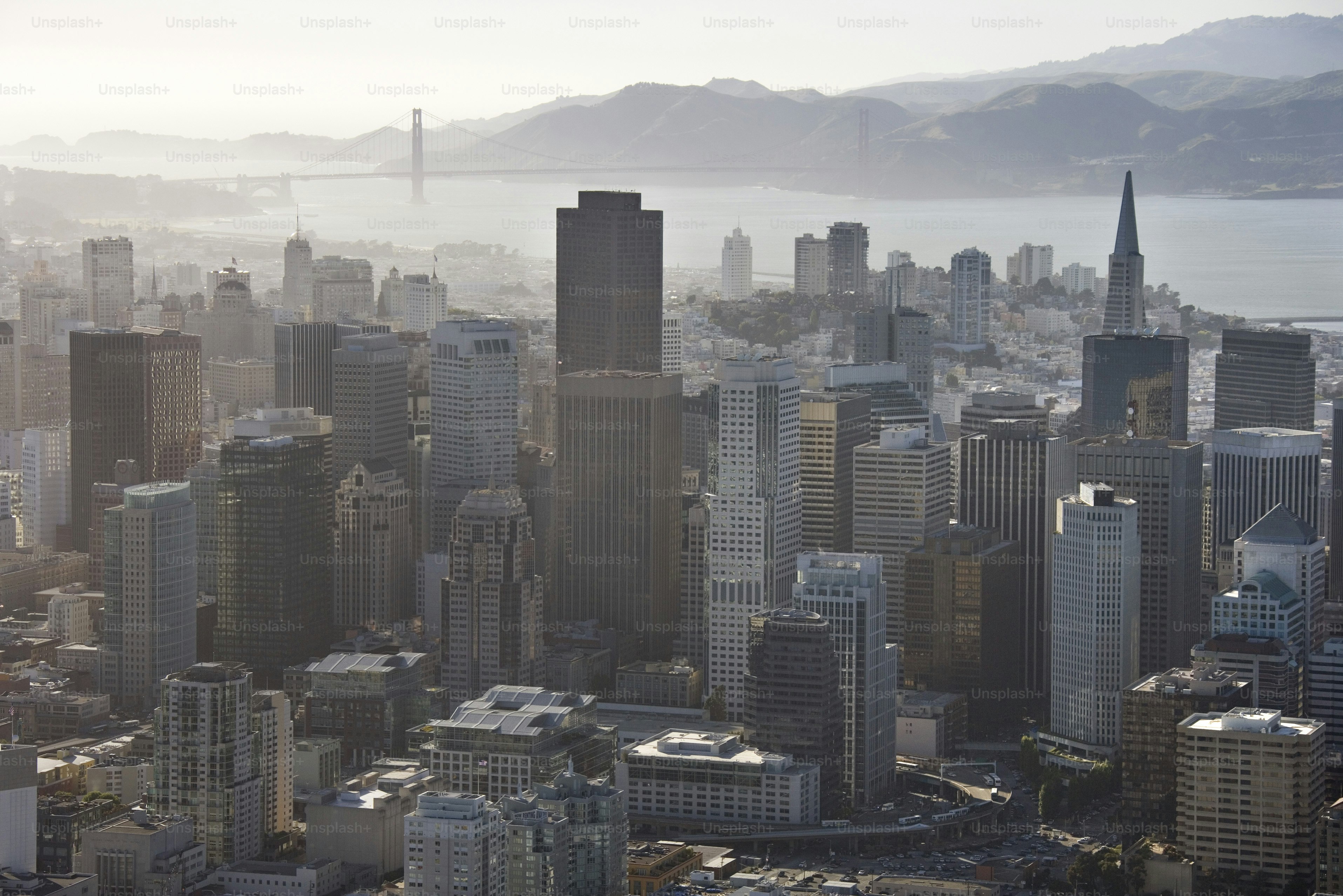 a view of a city with a bridge in the background