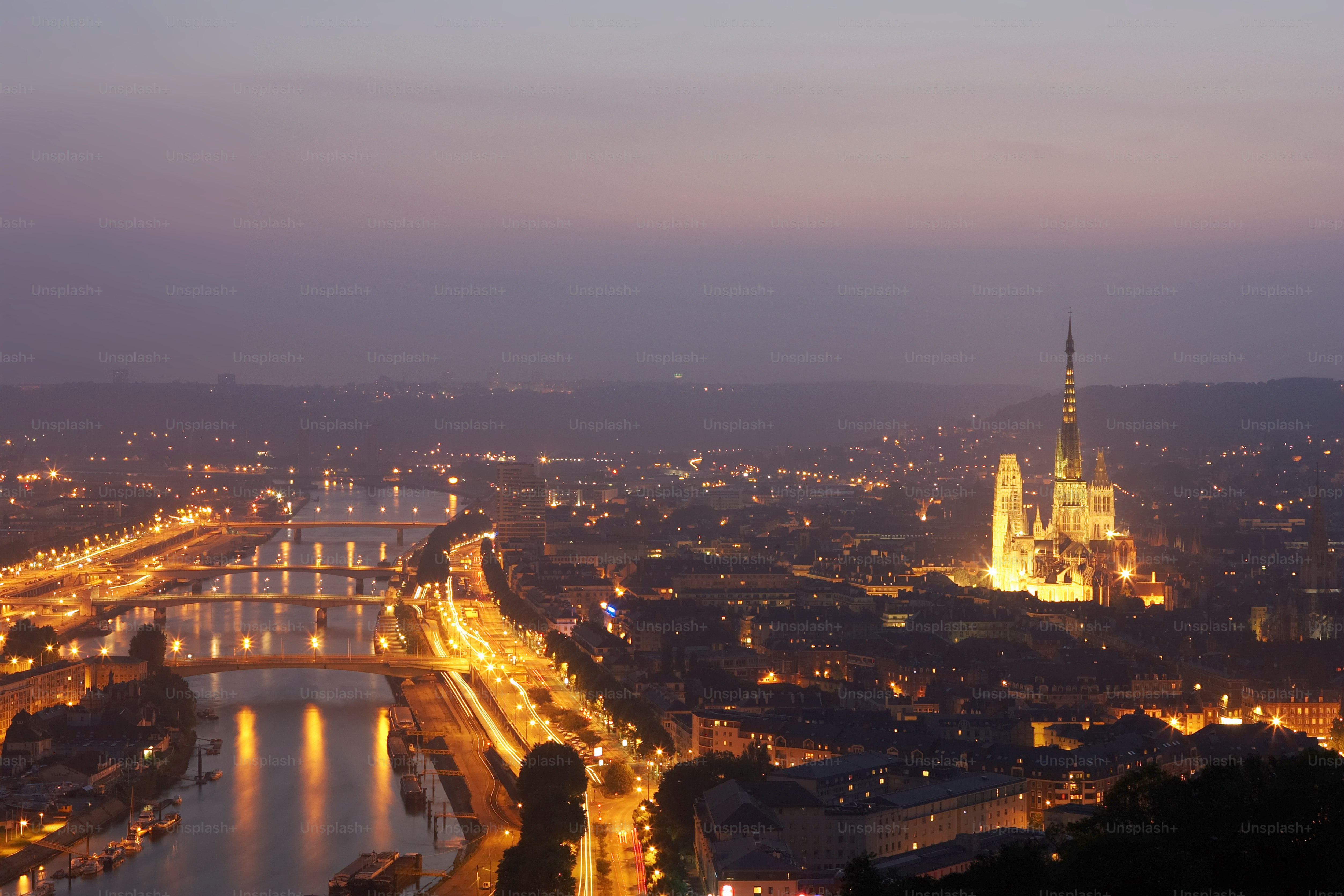 The river Seine runs through Rouen with the Rouen Cathedral prominent to the right. Shot in June 2007