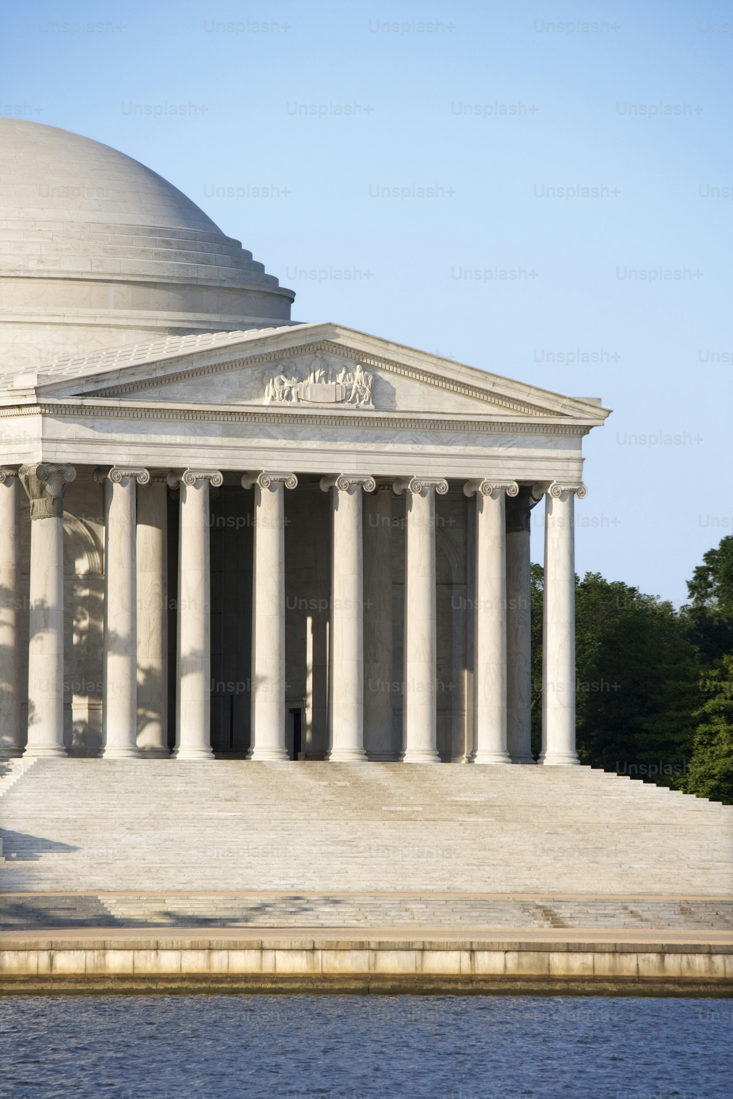 a large white building with columns and a dome