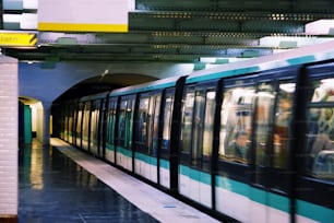 a subway train pulling into a train station