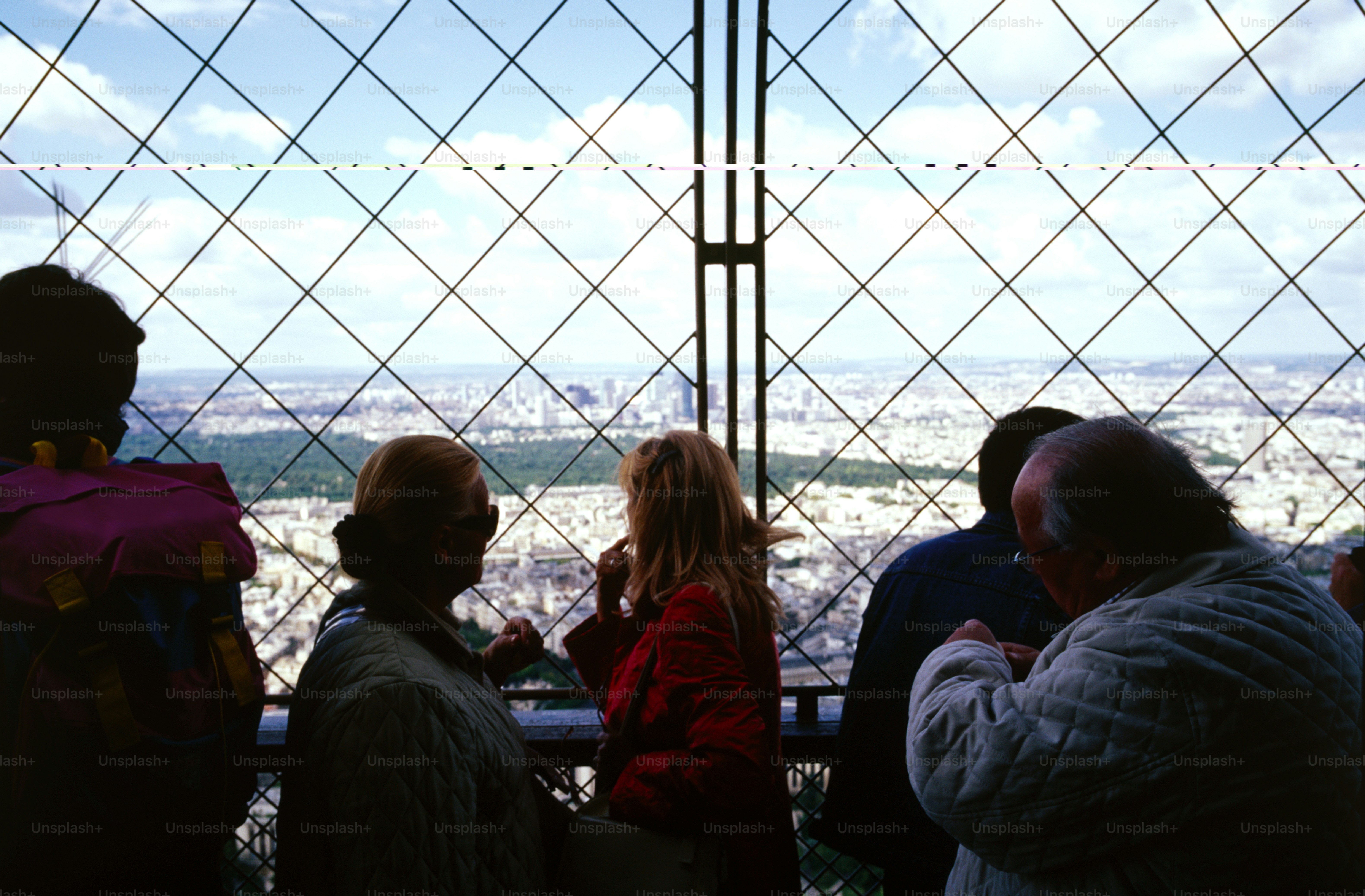 A group of people standing next to each other photo – Railing Image on ...