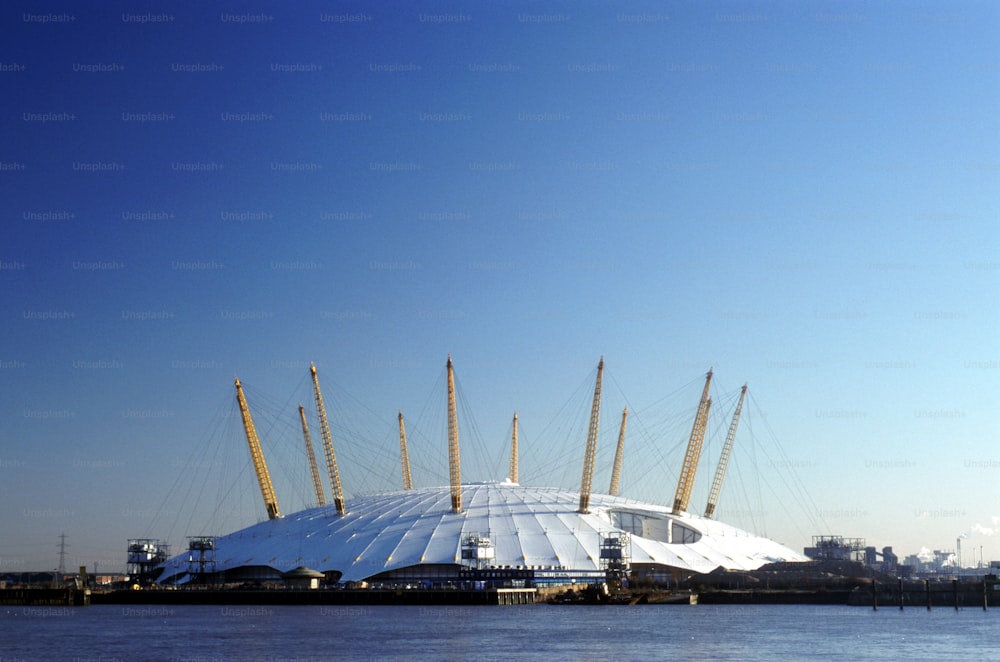 a large building sitting on top of a body of water