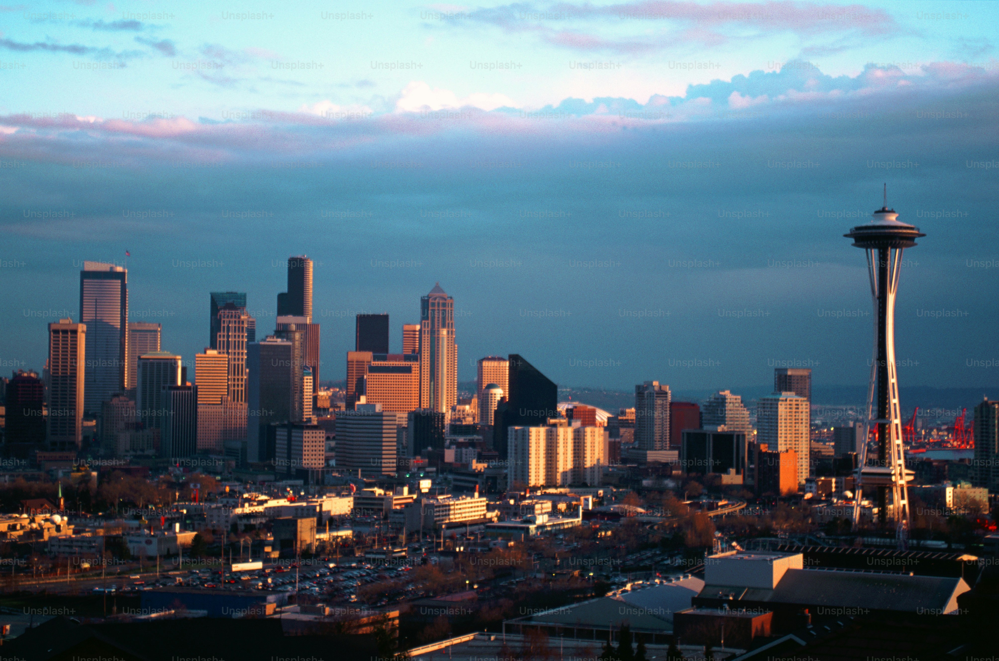 a view of a city with a tall tower in the background