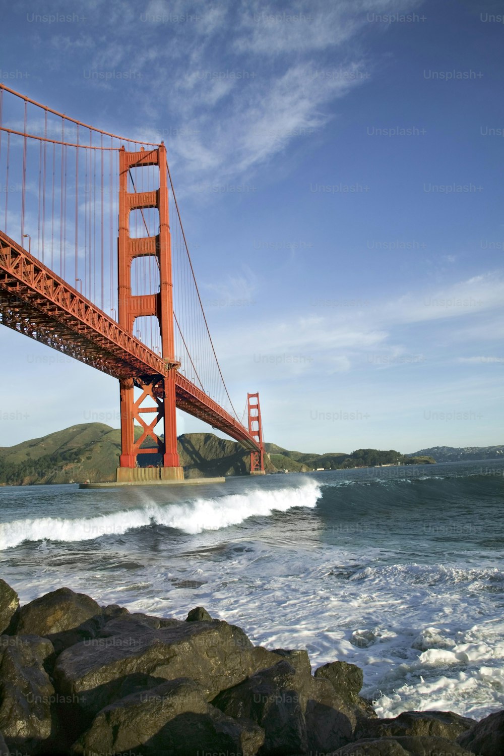 a view of the golden gate bridge from the beach