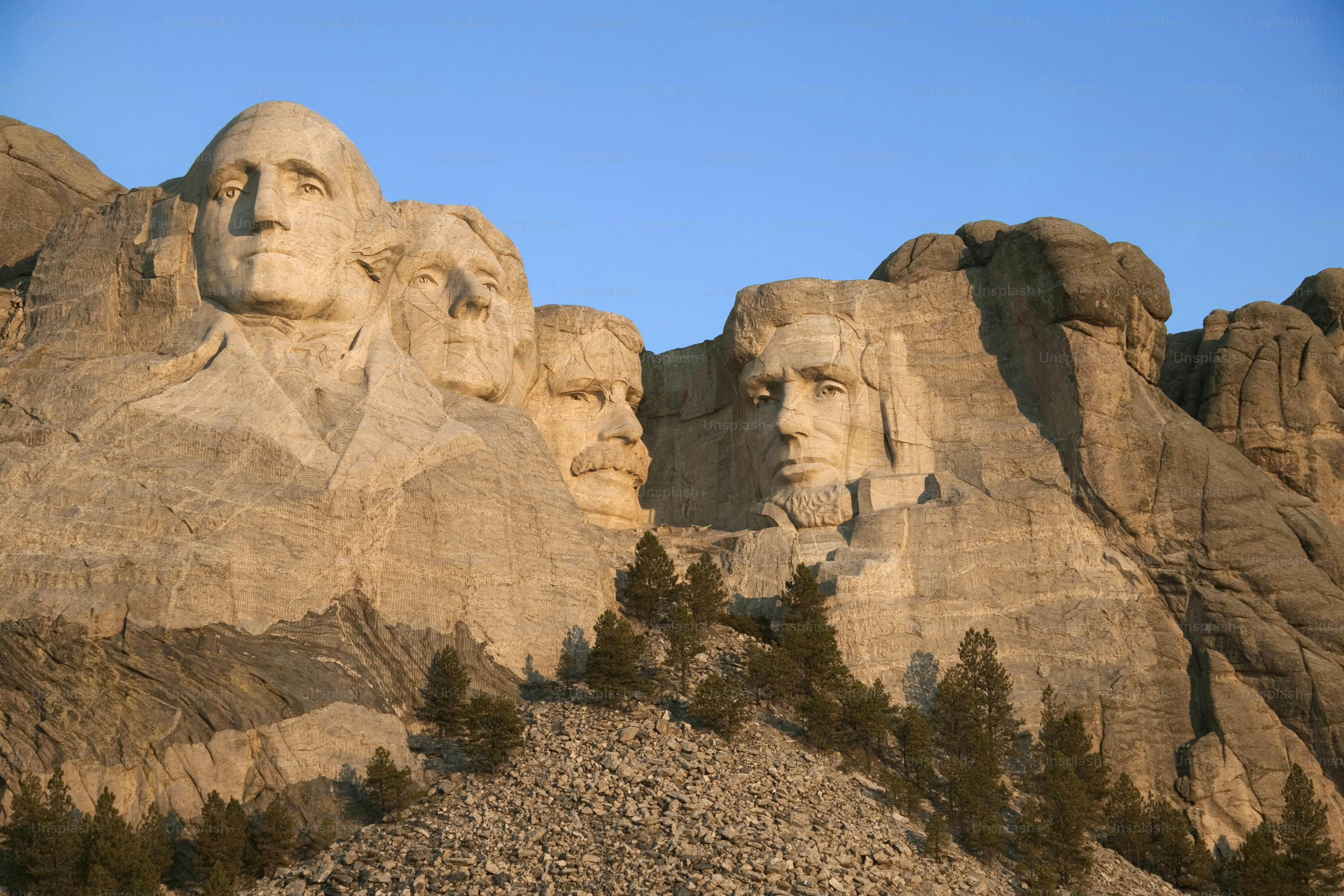 a group of presidents carved into the side of a mountain