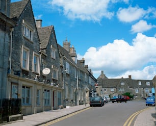 a street with cars parked on both sides of it