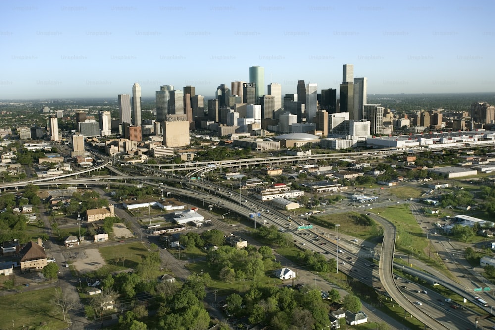 an aerial view of a city with a freeway