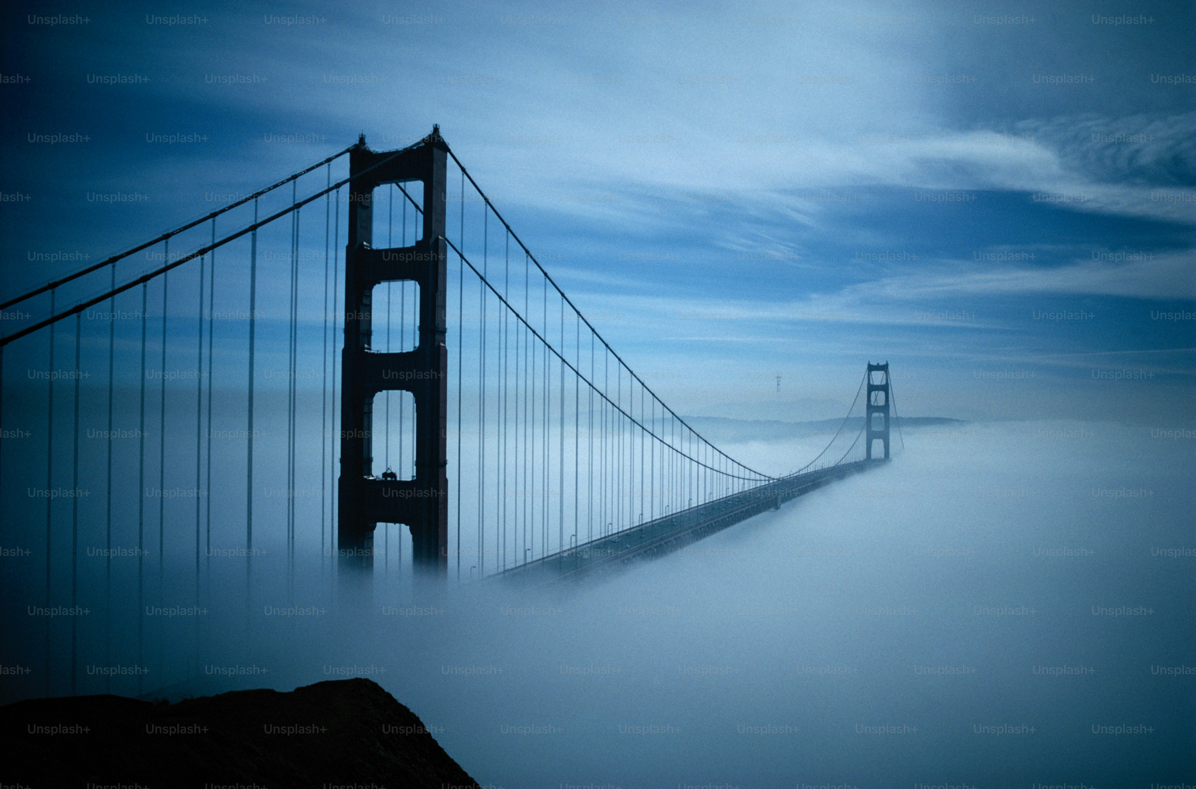 a foggy view of the golden gate bridge