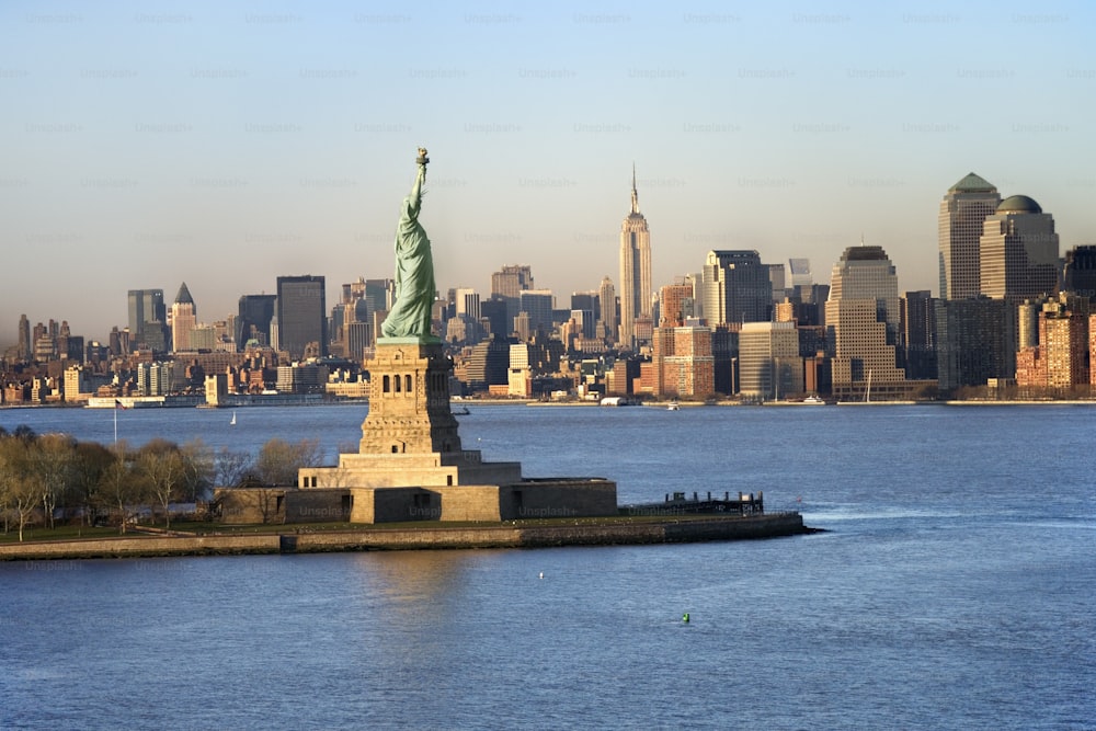 a large body of water with a statue of liberty in the middle of it