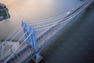 an aerial view of a bridge over a body of water