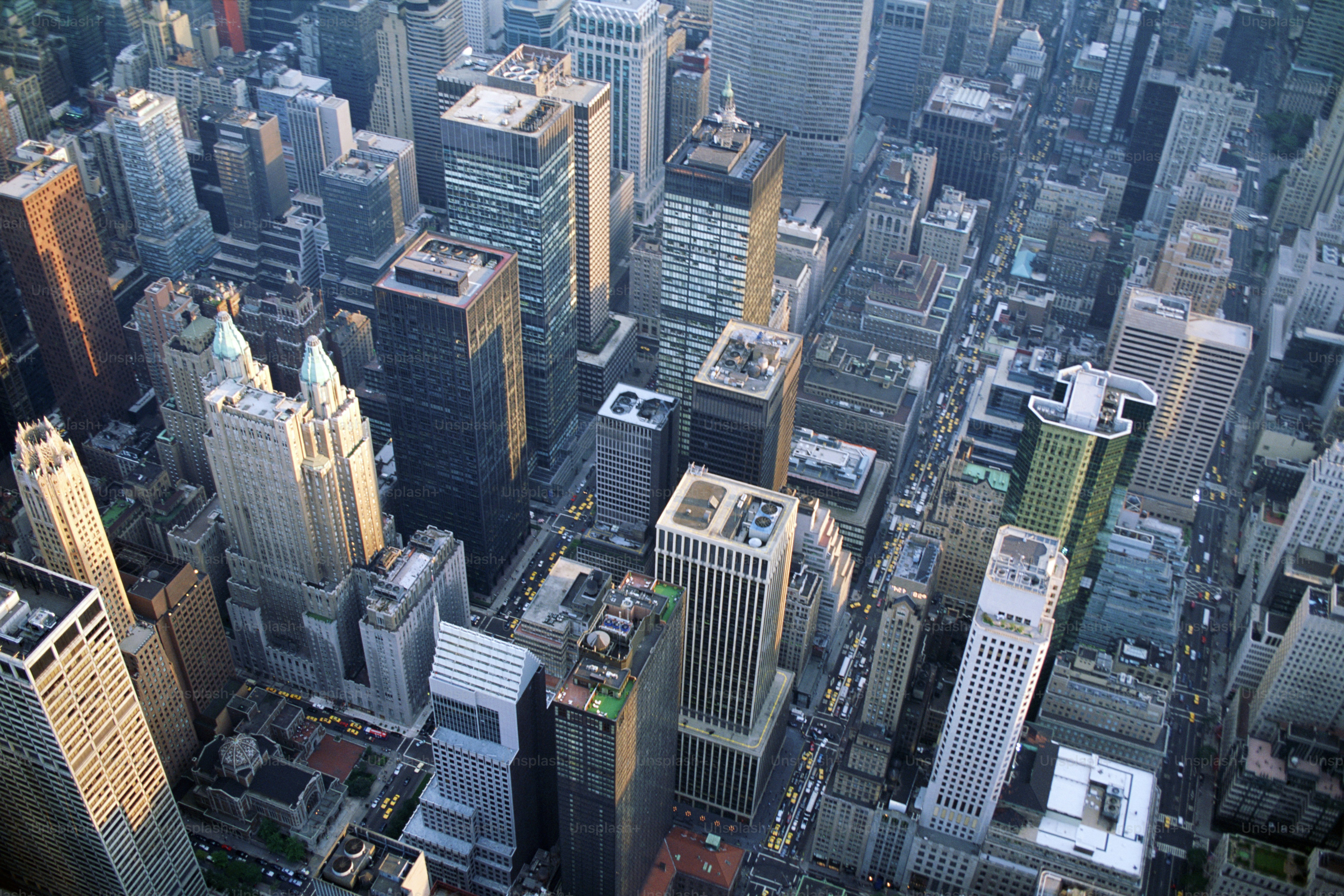 an aerial view of a city with tall buildings