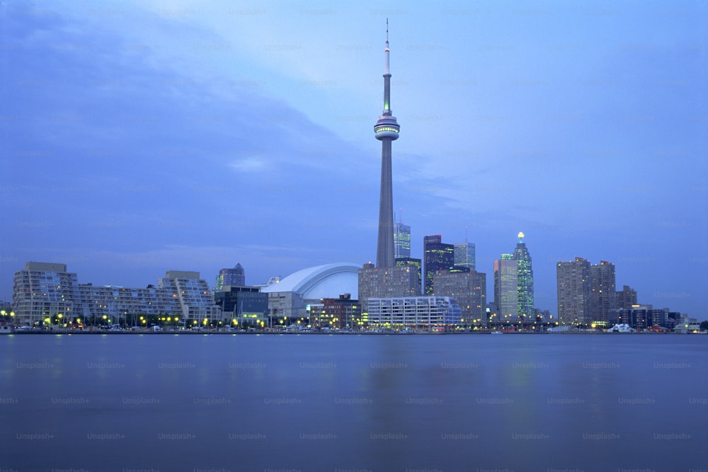 a large body of water with a city in the background