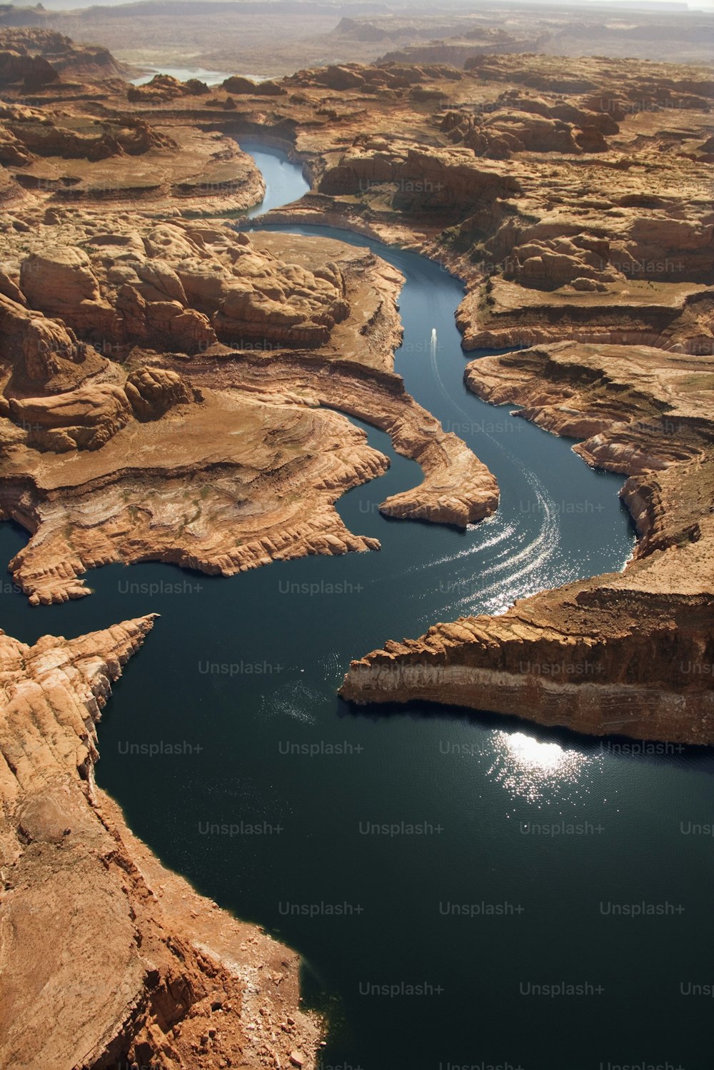 a river running through a canyon surrounded by mountains