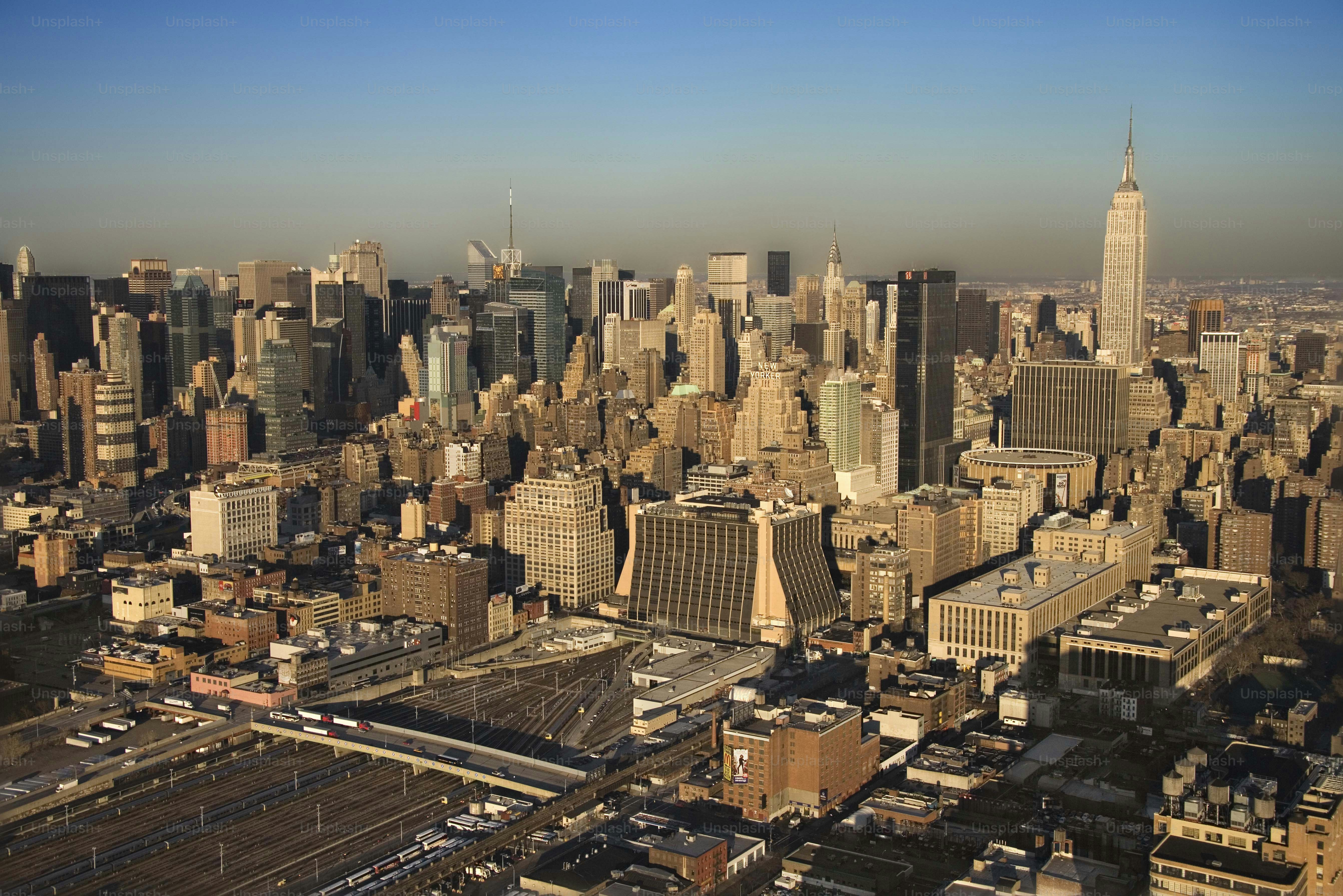 an aerial view of a city with tall buildings