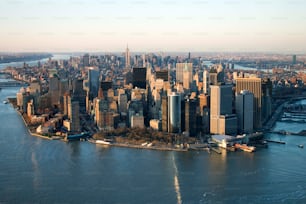 an aerial view of a large city and a body of water