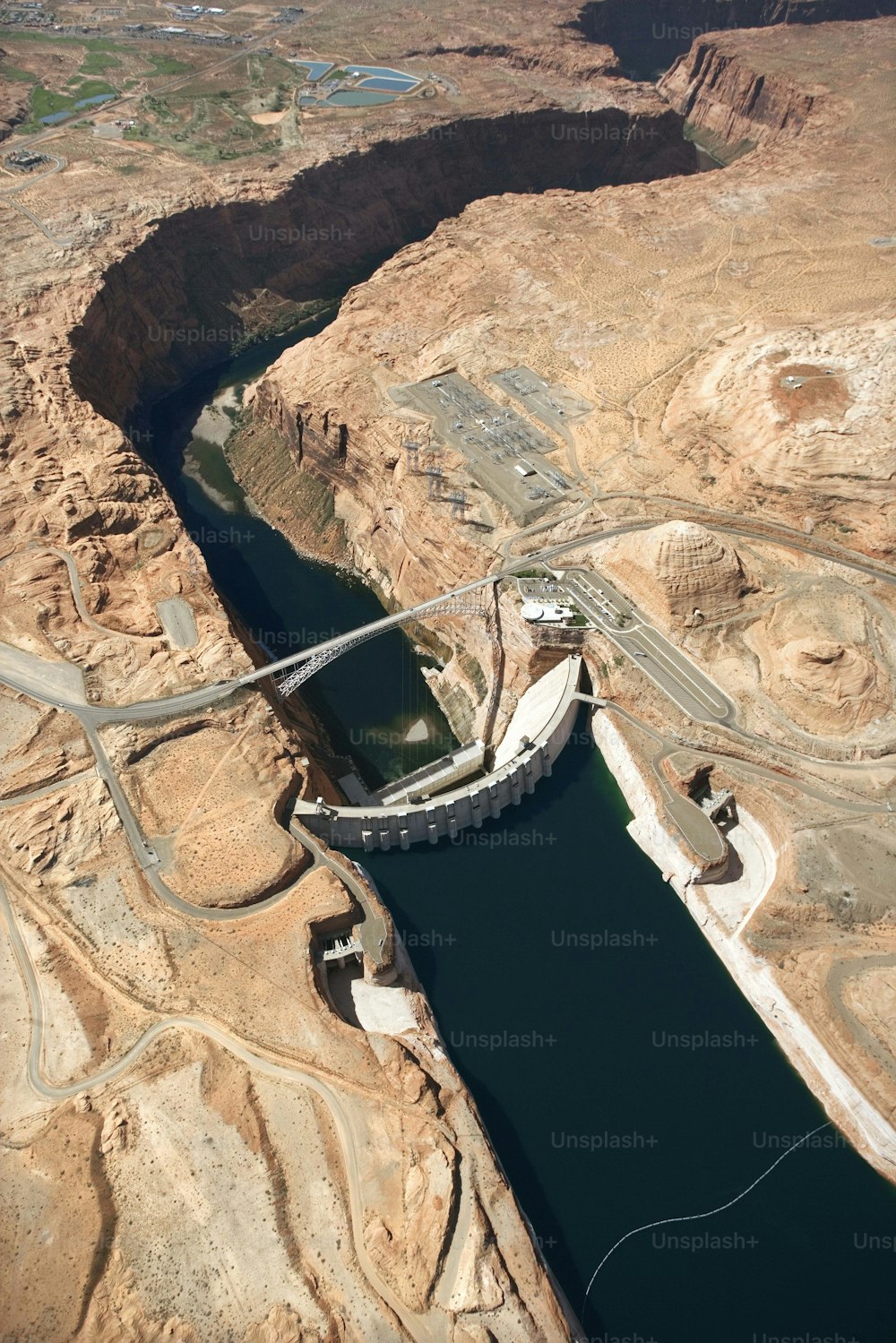 an aerial view of a dam in the desert