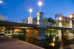 a bridge over a body of water at night