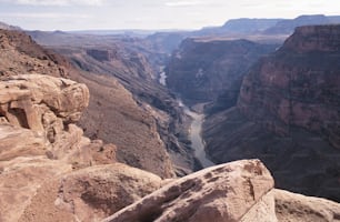 a view of a canyon with a river running through it