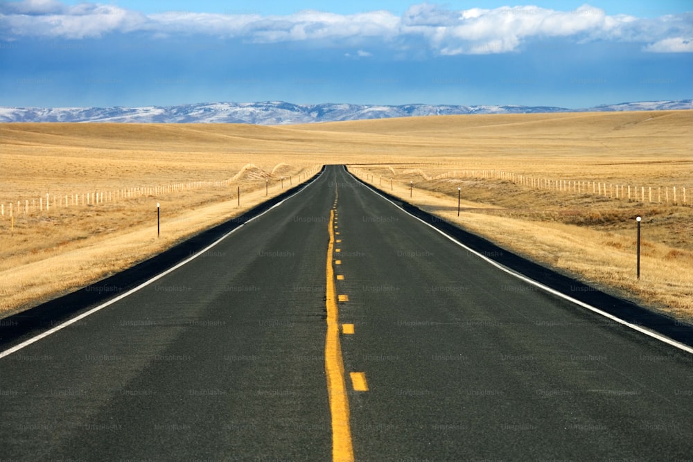 a long empty road in the middle of nowhere