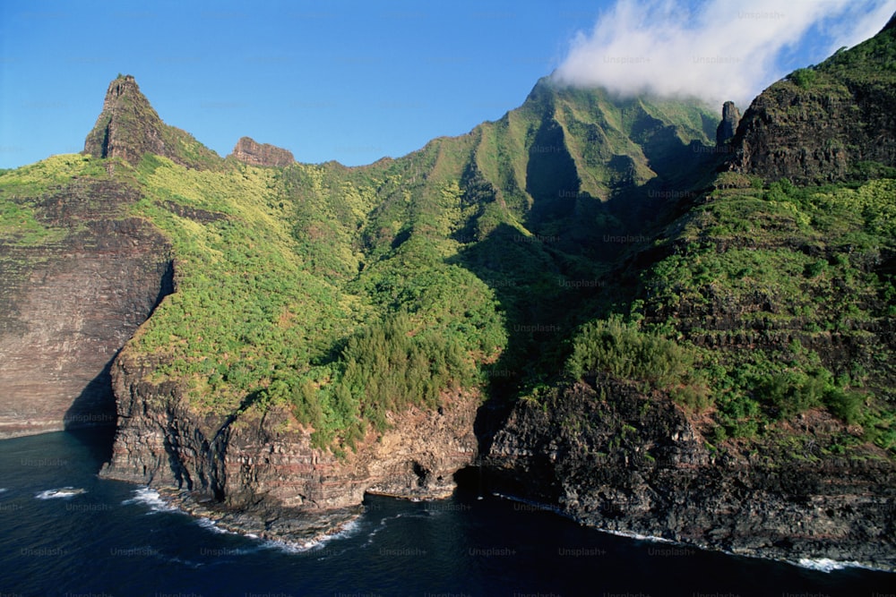 a view of a mountain with a body of water below it