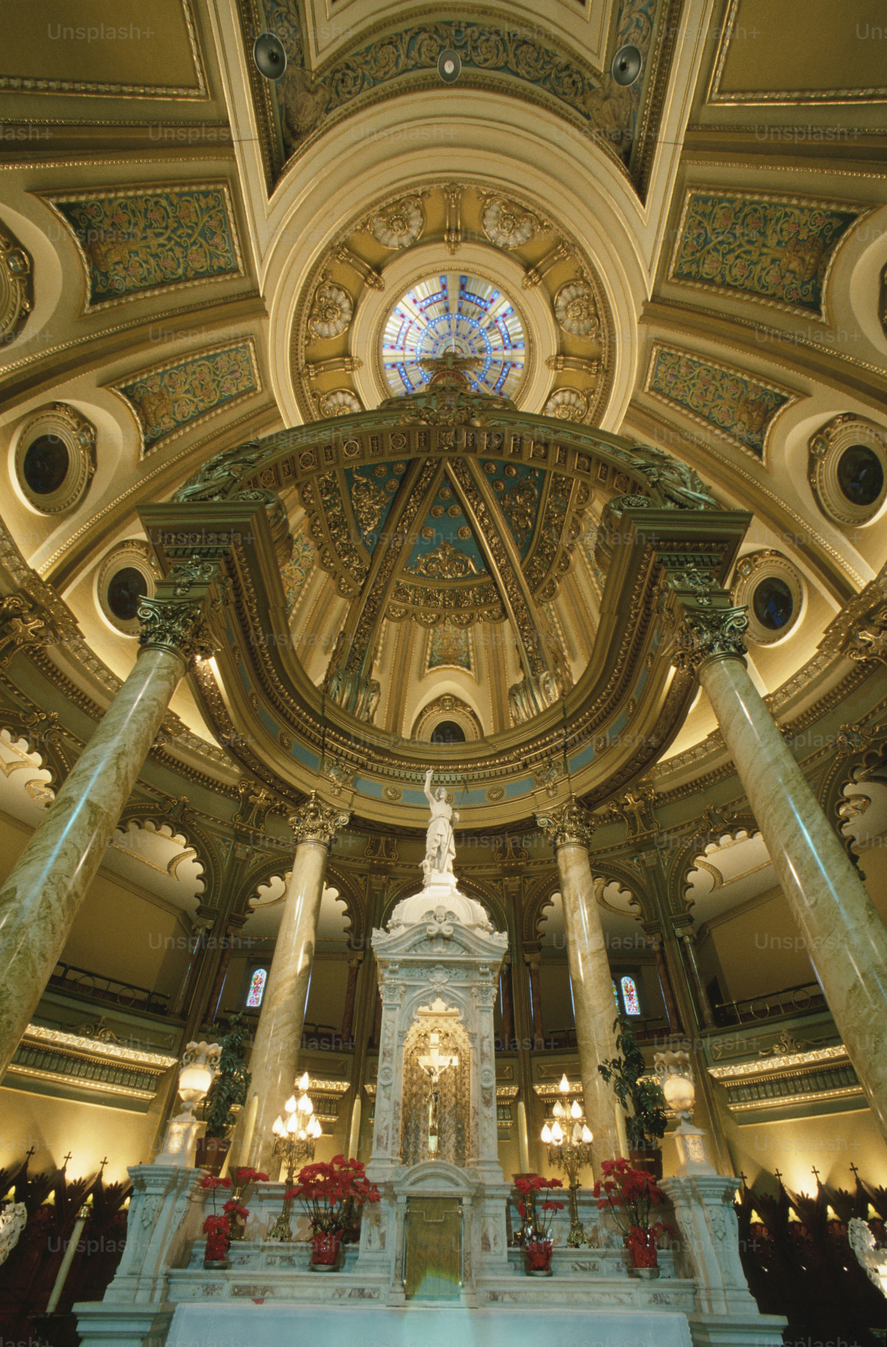 a large cathedral with a statue in the middle of it