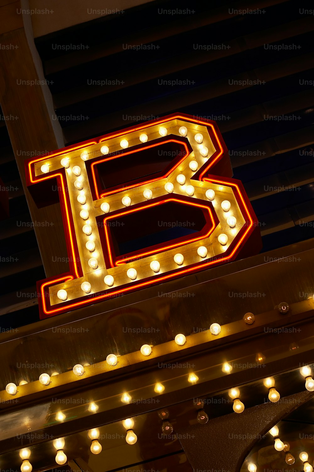 a lighted sign that reads b is for b