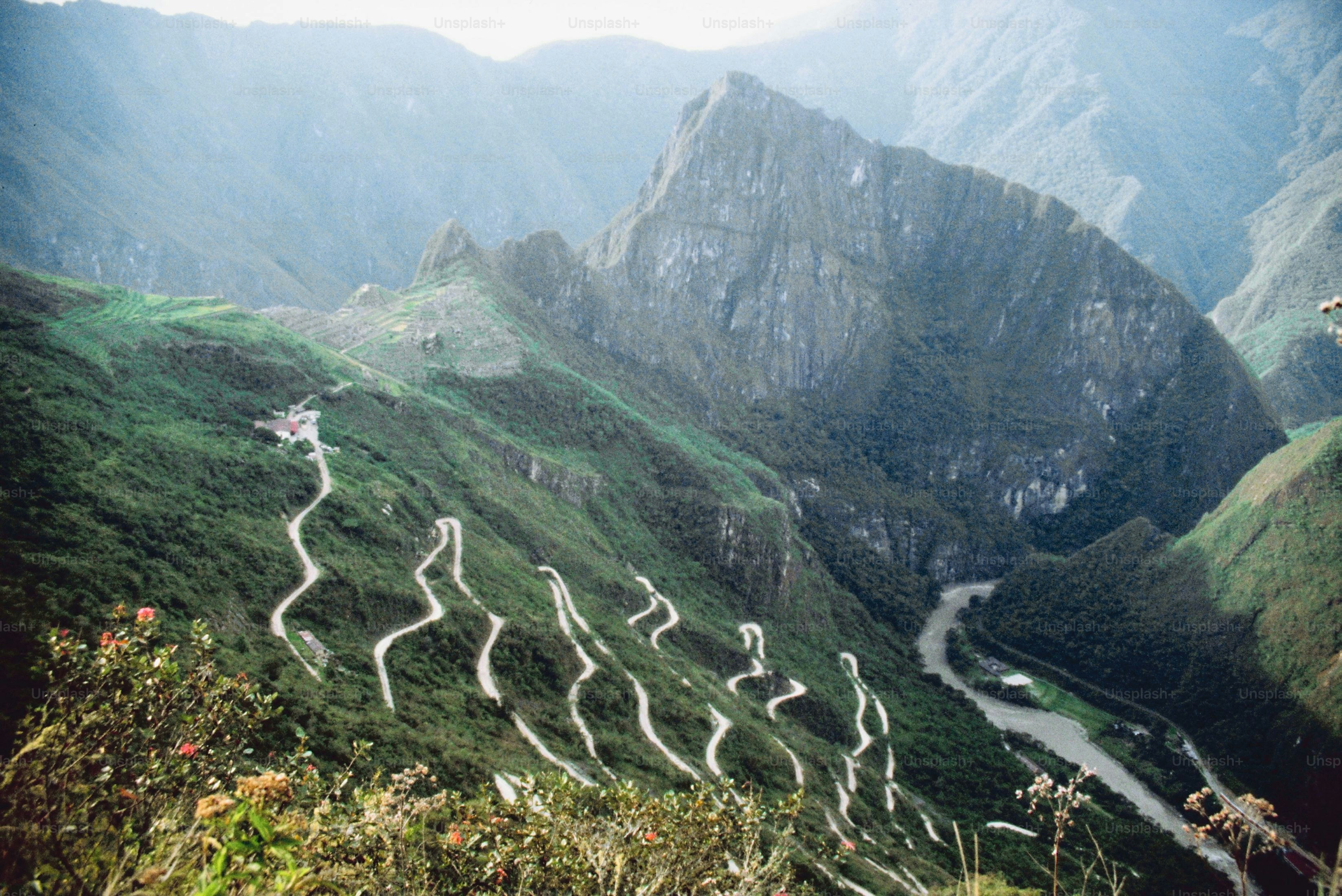 a view of a winding road in the mountains