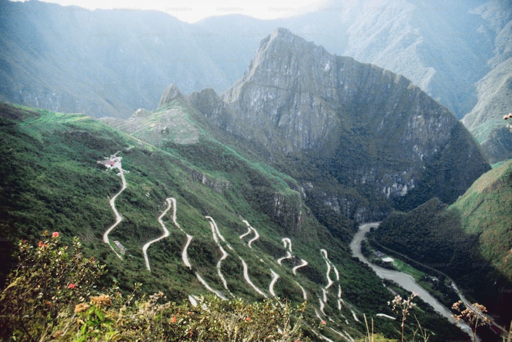 a view of a winding road in the mountains