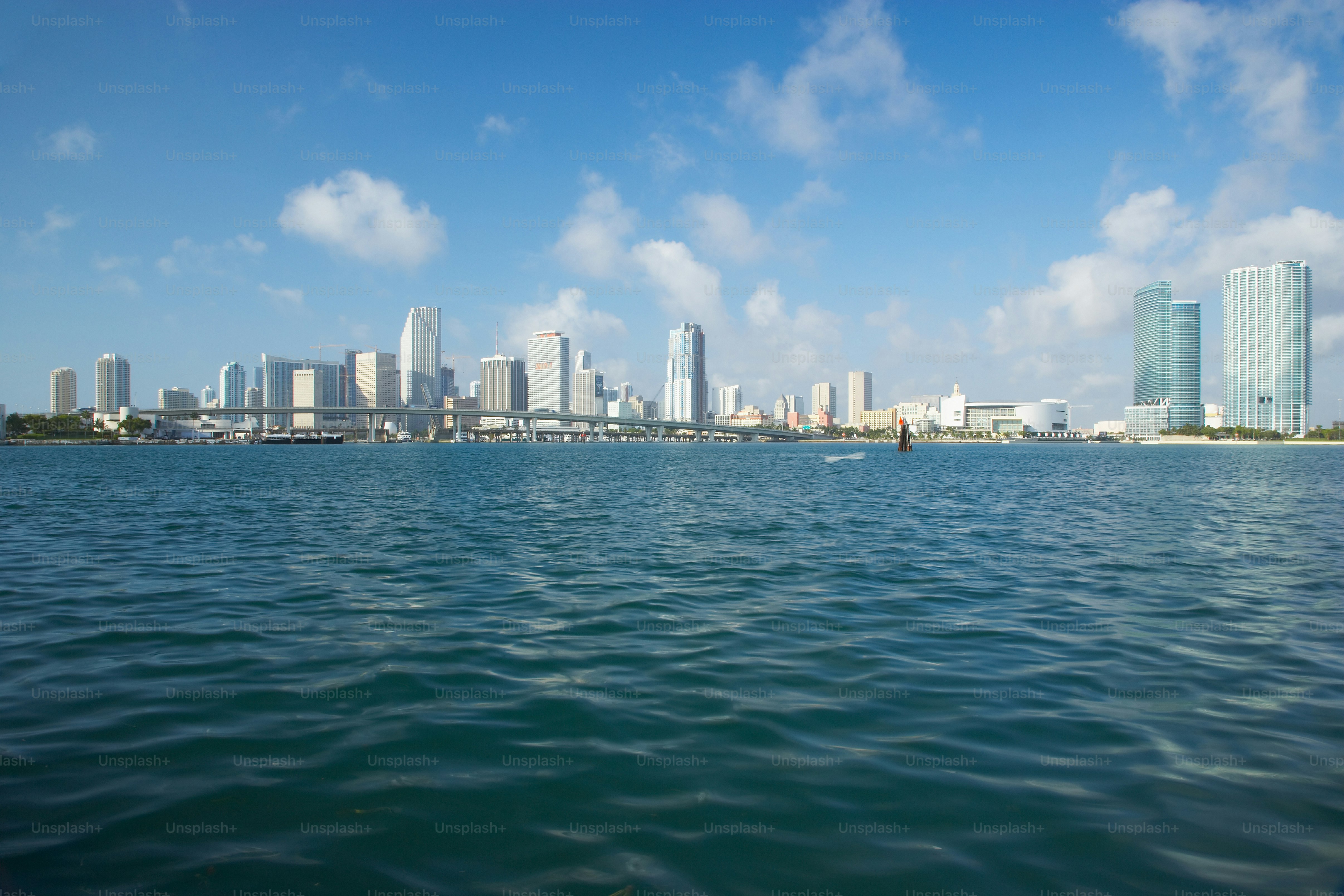 a body of water with a city in the background