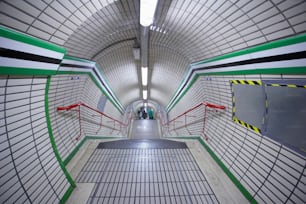 a long hallway with a tiled floor and walls