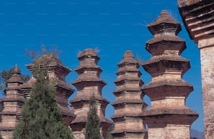 a group of stone towers sitting next to each other