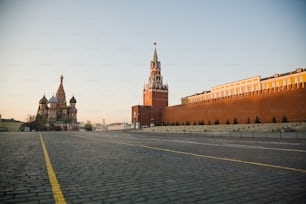 a large brick building with a clock tower in the background