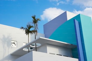 a building with a palm tree in front of it