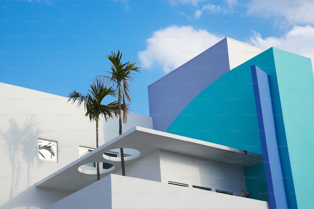 a building with a palm tree in front of it