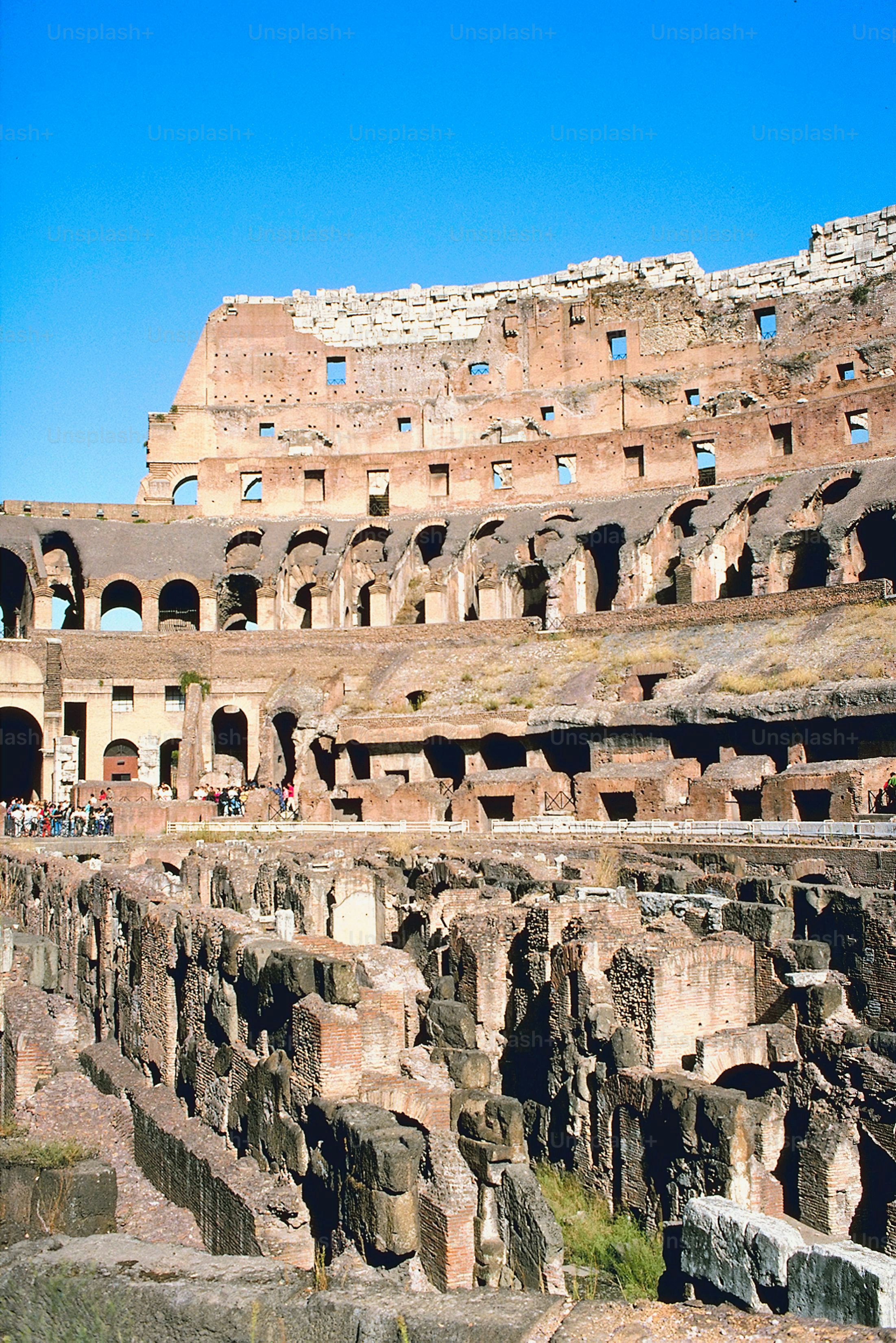 a group of people standing inside of an old building