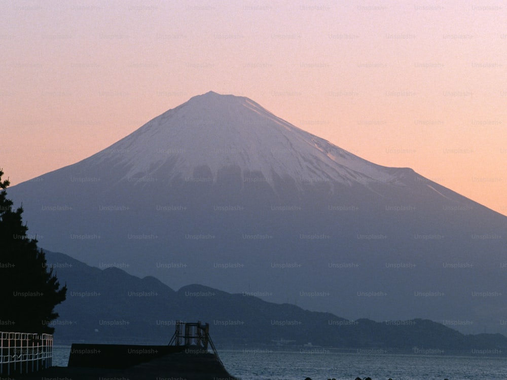 a view of a mountain with a body of water in front of it