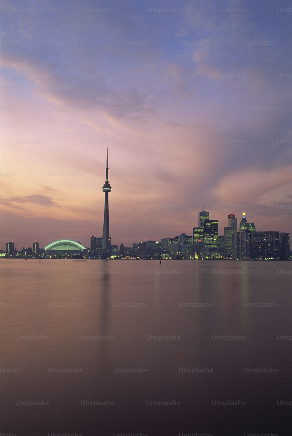 a large body of water with a city in the background